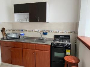 Η κουζίνα ή μικρή κουζίνα στο Centro Paipa +7 φωτογραφίες