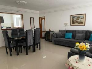 a living room with a couch and a table at Centro Paipa in Paipa