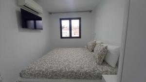 Postel nebo postele na pokoji v ubytování Apartamento Sol 523 Puerto Feliz