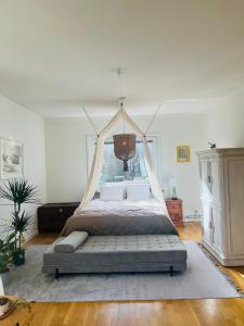 a bedroom with a bed with a canopy at Haha Familjesol in Gothenburg
