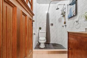 a bathroom with a toilet and a shower at Charming 2-Bedroom Retreat in Lomas de Bezares in Mexico City +26 photos