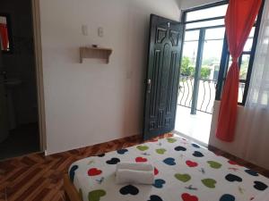 Postel nebo postele na pokoji v ubytování HotelSueños de Acapulco-Eje cafetero-Quindio
