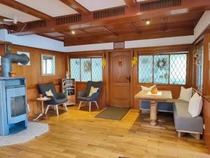 a living room with wooden walls and wooden floors at Boutique-Hotel Krone in Denzlingen