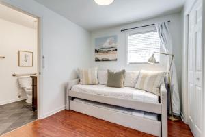 a living room with a couch and a window at Glass Street Bungalow HOT TUB Walk to Franklin in Franklin +45 photos