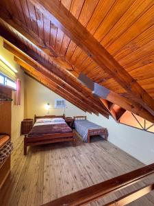 a bedroom with a bed and a wooden ceiling at HColon in Colón