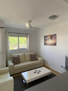 a living room with a couch and a coffee table at Condado de Alhama, Jardin 7 in Alhama de Murcia +38 photos