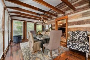 a dining room with a table and a chair at Private Retreat Burwood 8 acres Hot Tub Fire pit in Spring Hill