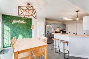 a kitchen and dining room with a wooden table and chairs at Vacation N the Station Spacious Cozy 3 bed in Thompsons Station