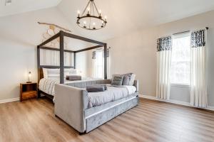 a living room with a couch and a large mirror at Vacation N the Station Spacious Cozy 3 bed in Thompsons Station
