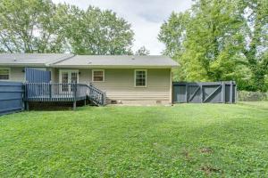 a house with a fence in a yard at Sunset Stay Pet Friendly 2bed 1 bath in Murfreesboro