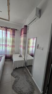 Postel nebo postele na pokoji v ubytování sunset paradise