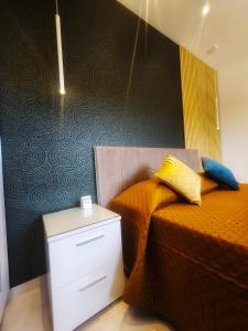 a bedroom with two twin beds and a night stand at Country View Retreat in Żabbar