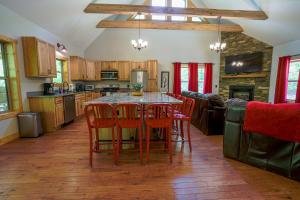 a kitchen with a table and chairs in a room at Foothills Family Retreat - 7 Bedrooms, Hot Tub in Cleveland