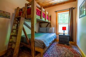 a bedroom with two bunk beds in a room at Foothills Family Retreat - 7 Bedrooms, Hot Tub in Cleveland