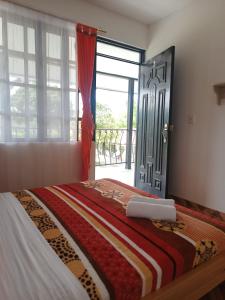 Postel nebo postele na pokoji v ubytování HotelSueños de Acapulco-Eje cafetero-Quindio