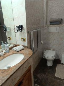 a bathroom with a sink and a toilet at Regina sul Mare in Terracina +46 photos