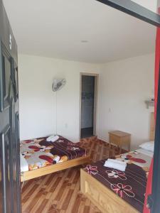 Postel nebo postele na pokoji v ubytování HotelSueños de Acapulco-Eje cafetero-Quindio