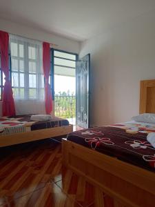 Postel nebo postele na pokoji v ubytování HotelSueños de Acapulco-Eje cafetero-Quindio