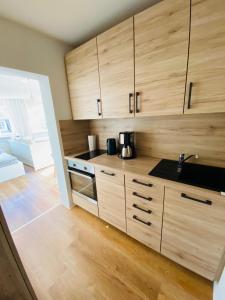 Η κουζίνα ή μικρή κουζίνα στο Ferienwohnung Haus zum See
