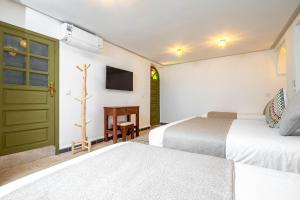 Postel nebo postele na pokoji v ubytování Riad Hamdane et SPA