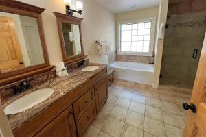 a bathroom with two sinks and a tub and a shower at Smoky Mountain High in Bryson City +39 photos