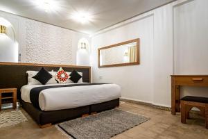 Postel nebo postele na pokoji v ubytování Riad Hamdane et SPA