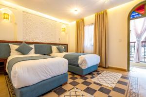 Postel nebo postele na pokoji v ubytování Riad Hamdane et SPA