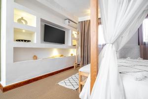 Postel nebo postele na pokoji v ubytování Riad Hamdane et SPA