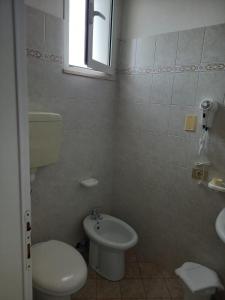 Koupelna v ubytování Hotel Serafini Misano Adriatico