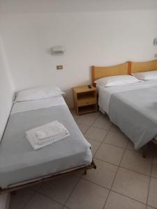 Postel nebo postele na pokoji v ubytování Hotel Serafini Misano Adriatico