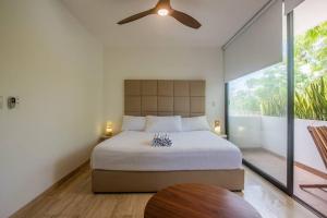 Giường trong phòng chung tại Amira Residence Confortable 1 BR in Aldea Zama