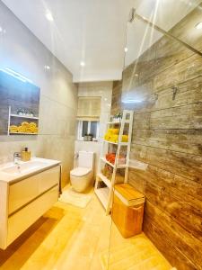a bathroom with a sink and a toilet at Country View Retreat in Żabbar