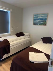 Una cama o camas en una habitación de Úthlíd Cottages