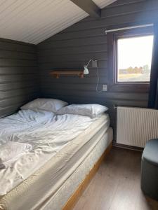 Una cama o camas en una habitación de Úthlíd Cottages