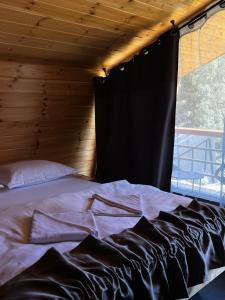 Gulta vai gultas numurā naktsmītnē Krusta Panoramic Resort