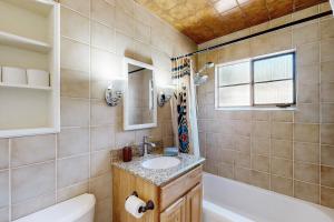 a bathroom with a sink and a toilet and a tub at Casa Mirador in Santa Fe +16 photos