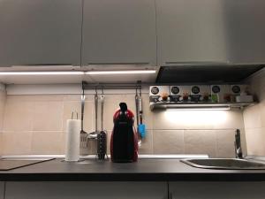 a kitchen counter with a bottle of liquid on the counter at 507 Green Oasis in Maspalomas