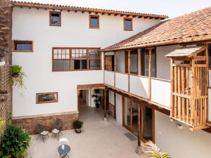 an external view of a house with wooden windows at Laguna Cool Living in Las Lagunas