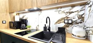 Kuchyňa alebo kuchynka v ubytovaní VIP Apartamenty VILLA GORSKI SEN