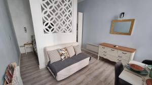 a living room with a couch and a table at Apartment Opera Vintage - Budapest City Centre in Budapest