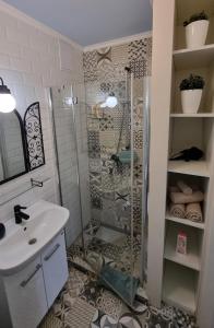 a bathroom with a shower and a sink at Apartment Opera Vintage - Budapest City Centre in Budapest