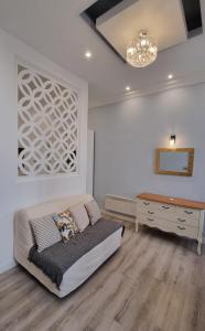a bedroom with a bed and a desk in it at Apartment Opera Vintage - Budapest City Centre in Budapest