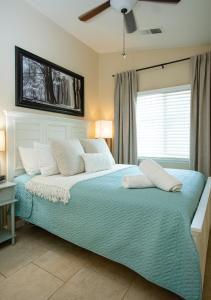 a bedroom with a bed with white pillows and a ceiling at Beautiful Condo by Park Entrance in Three Rivers