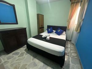 Postel nebo postele na pokoji v ubytování Hotel El Bosque