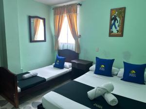 Postel nebo postele na pokoji v ubytování Hotel El Bosque