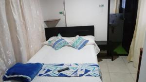 Hotel Guaquira Real客房内的一张或多张床位