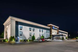 a hotel with cars parked in front of a parking lot at Best Western Montgomery I-85 North in Montgomery