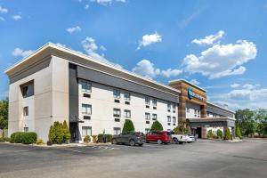 a hotel with cars parked in a parking lot at Best Western Montgomery I-85 North in Montgomery
