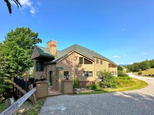 a house on the side of a road at C13 Beautiful Bretton Woods ski-in ski-out townhouse for your family getaway to the White Mountains! in Bretton Woods