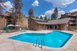 a swimming pool in the courtyard of a building at Wild Irishman #1030 by Summit County Mountain Retreats in Keystone